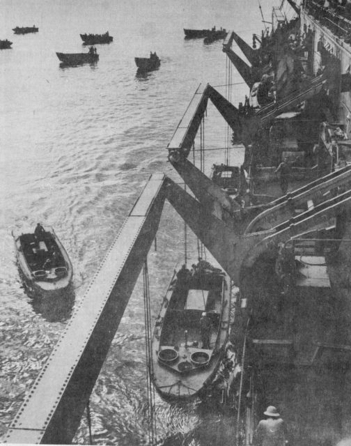 LCPs being lowered down to the water, from a US Navy transport, uring the invasion of Guadalcanal.