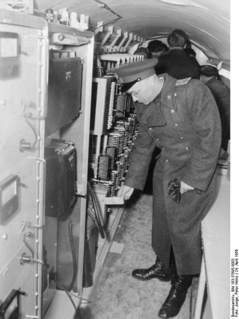 Soviet officer inspecting the underground hole used to spy on the Soviet Embassy in 1956 Photo Credit