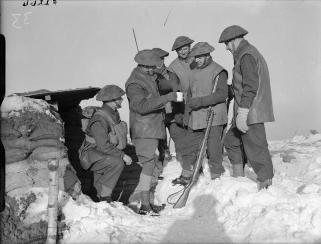 The 2nd Battalion, Royal Norfolk Regiment on February 26, 1940, in France receiving their rum rations before patrol duty.