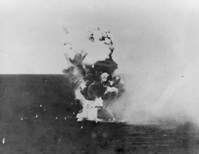 USS Columbia is engulfed in flames as a kamikaze hits. Image Source: Wikimedia Commons/ Public Domain