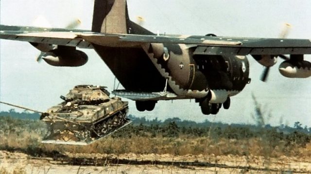 A C-130 delivering an M551 Sheridan tank using LAPES (Low Altitude Parachute Extraction System);
