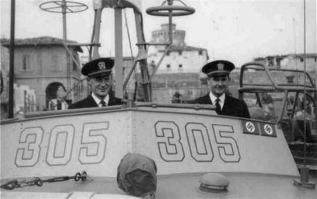 Ensign Bleeker Morse (left) and Lieutenant Junior Grade Allan Purdy on the bridge of PT-305 in Leghorn (Livorno), Italy, on March 16, 1945. The “kill plaques” on the chart house signify the two enemy craft sunk by PT-305 to that date. Gift of Joseph Brannan. Courtesy of The National WWII Museum