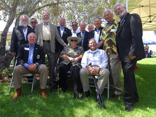 John Finn seated bottom right with other Medal of Honor recipients celebrating his 100th birthday.