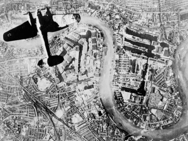 German Luftwaffe Heinkel He 111 bomber flying over Wapping and the Isle of Dogs in the East End of London at the start of the Luftwaffe’s evening raids of 7 September 1940