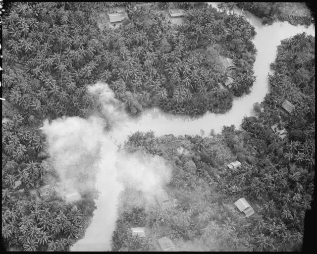 The bombing of Viet Cong structures along a canal in South Vietnam.