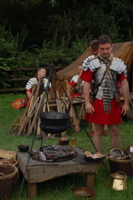 Reenactors portray Roman soldiers in camp. By Portable Antiquities Scheme – CC BY 2.0