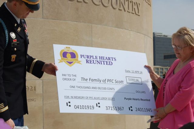 Major Zachariah Fike presents a check from the Scholarship Fund. Hannah Doyle – CC BY-SA 4.0