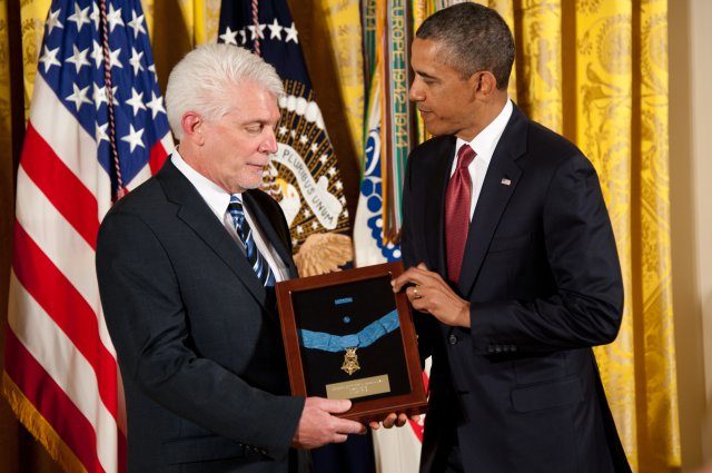 President Barack Obama presents the Medal of Honor to Ray Kapaun, nephew of Chaplain (Capt.) Emil J. Kapaun, the posthumous recipient of the Medal of Honor, at the White House in Washington D.C. April 11, 2013. Credit: U.S. Army photo by Sgt. Laura Buchta.