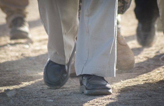 Retired U.S. Army Col. Ben Skardon, 98, a Bataan Death March survivor, walks 8.5 miles in the 27th annual Bataan Memorial Death March wearing comfortable loafers, slacks, and a button-up dress shirt, unlike most of the other 6,613 participants who wear high-tech running and hiking gear. Credit: U.S. Army photo by Staff Sgt. Ken Scar.