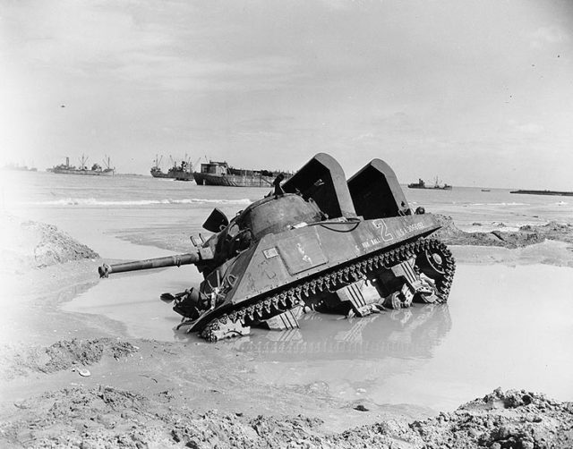 A Sherman tank mired in the mud on D-Day.