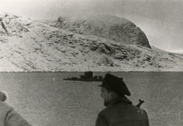 U-537 crewmen rowing toward their landing site on the Hutton Peninsula twenty miles south of Cape Chidley on Newfoundland’s Labrador coast on October 23, 1943. Note the muzzle of an MP-40 sub-machine gun is visible above the crewman’s right shoulder.