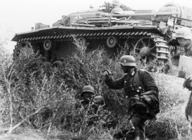 Battle of Stalingrad: Infantry and a supporting StuG assault gun advance towards the city center; Photo Credit