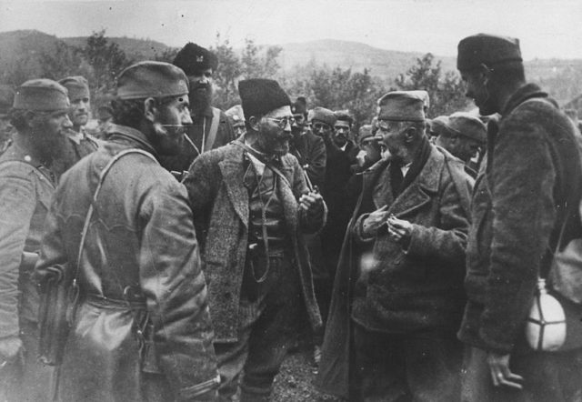 Mihailović confers with his men;
