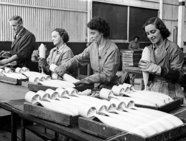 Workers inspecting practice bombs at a factory in South Australia during 1943. Photo Credit