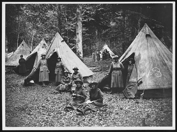 Members of the Q.M.A.A.C. encamped in a big forest in France.