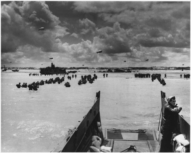Troops land at Normandy.