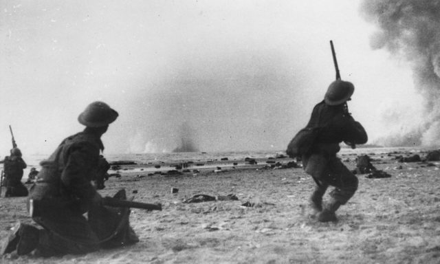 Soldiers from the British Expeditionary Force fire at low flying German aircraft during the Dunkirk evacuation.