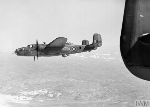 Mitchell Mark II, of No. 98 Squadron RAF based at Dunsfold, Surrey, approaches the English Channel south of Etaples while returning from a ‘Noball’ operation over northern France. Note the deployed ventral turret. Photo Credit