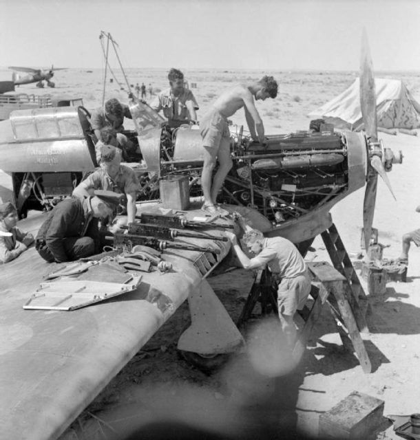 Groundcrew of No. 274 Squadron RAF overhaul Hawker Hurricane Mark I (V7780 “Alma Baker Malaya”) at LG 10/Gerawala, Libya, during the defence of Tobruk.