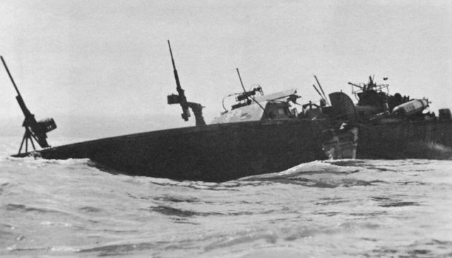 Photo depicts PT-323 cut almost cut in half after a Kamikaze attack on December 10, 1944.