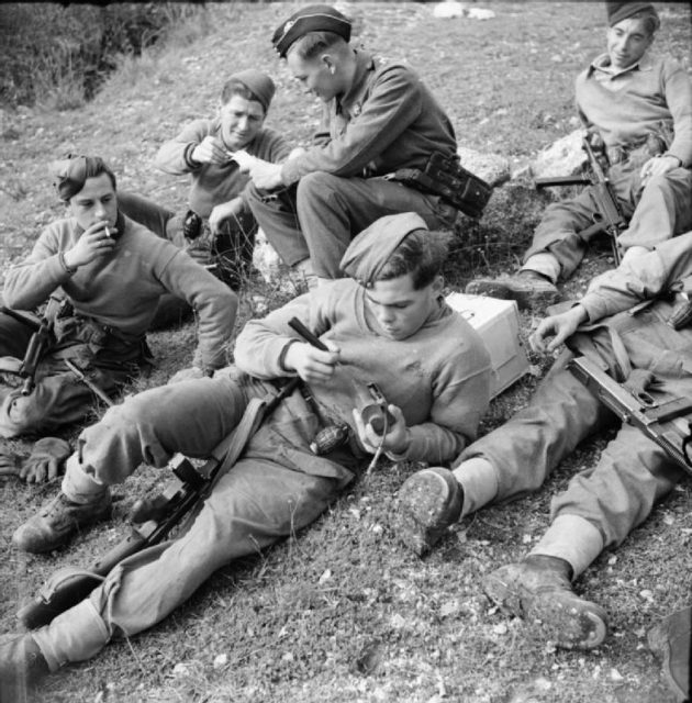 A patrol of the 1st Battalion, East Surrey Regiment resting in France on seen here during world war two – December 16, 1943.