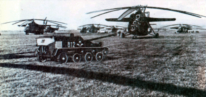 ASU-57 tank destroyer/assault gun with several Mil Mi-6 helicopters of Soviet Airborne Troops.