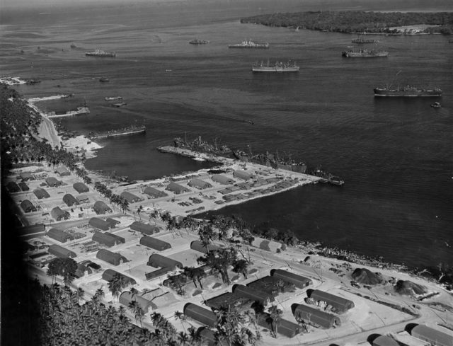 An aerial photograph of the US Navy base at Luganville on Espiritu Santo. Dozens of Quonset huts can be seen lining the foreshore. Photo: US Navy.