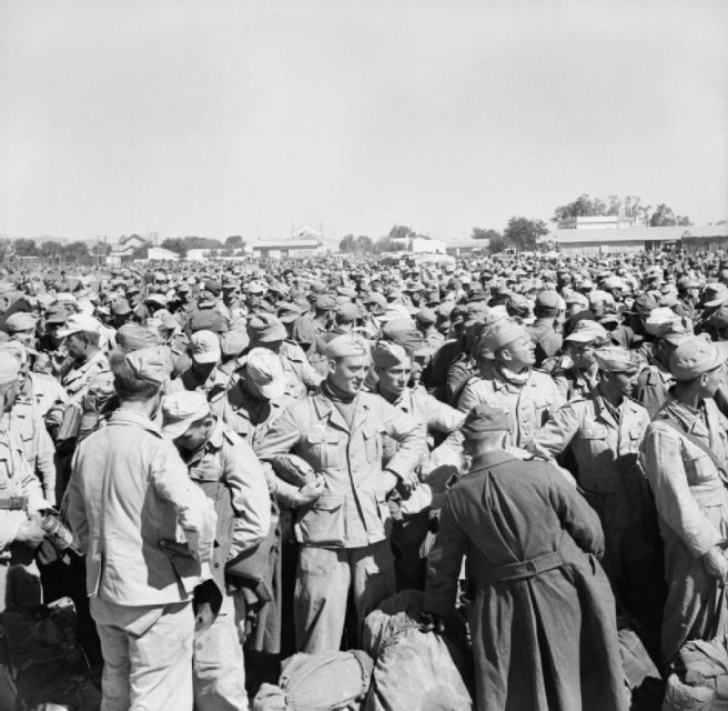 Scores of German and Italian prisoners at Gromalia prisoner of war camp after the fall of Tunis.