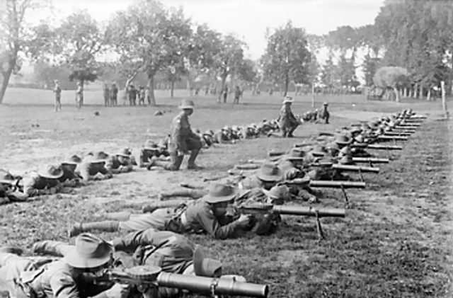 Men of the 28th Battalion of the 2nd Australian Division are practising Lewis gun drill at Renescure.