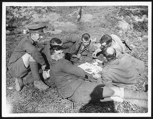 Men of the 8th Battalion, King’s Own Yorkshire Light Infantry playing cards near Ypres, 1 October 1917.