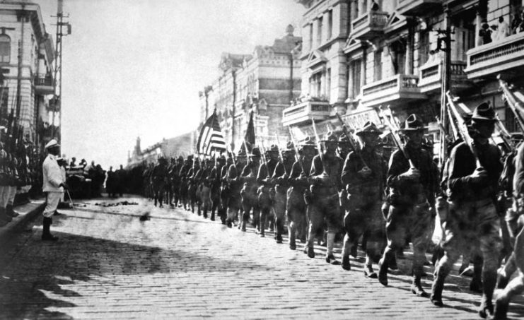 American soldiers in Vladivostok parading before the building occupied by the staff of the Czechoslovaks.