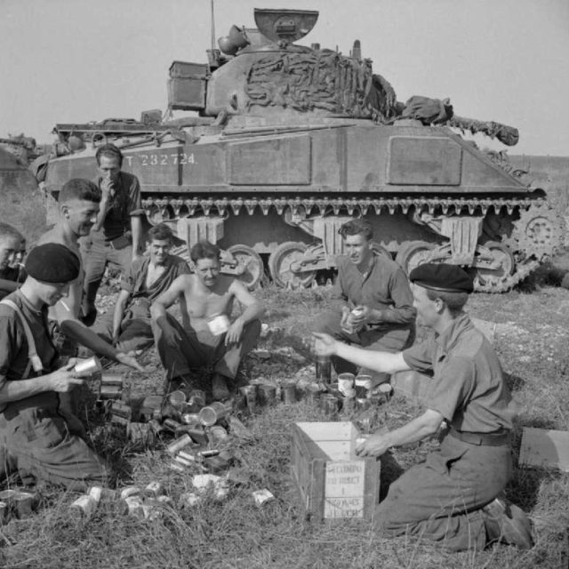 Crew from the Northamptonshire Yeomanry eating rations.