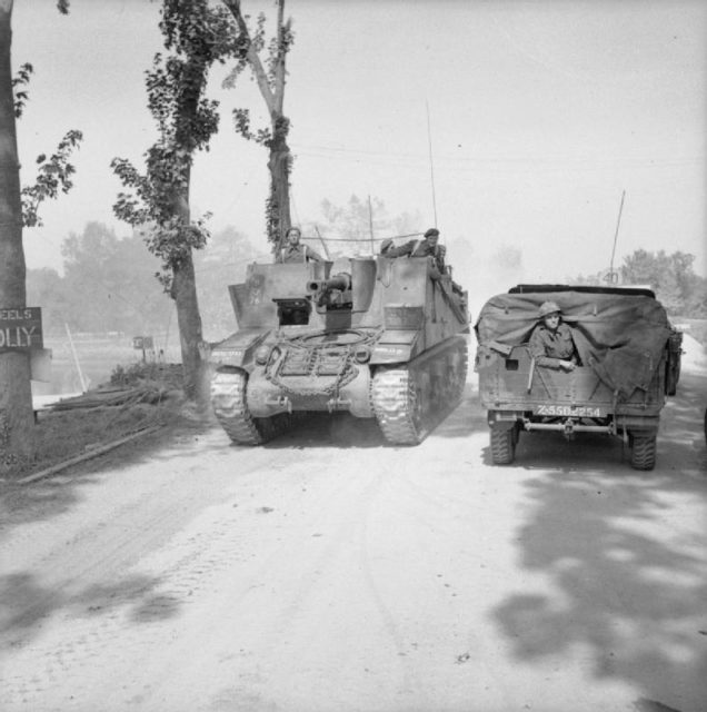 Sexton self-propelled gun moving up towards Escoville during Operation ‘Goodwood’, 18 July 1944.