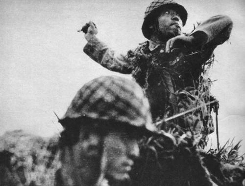 Japanese soldier throwing a Type 91 grenade, Guadalcanal, Solomon Islands, September 1942.
