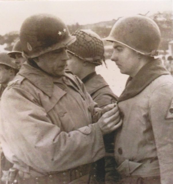 Major General Maurice Rose, commander of 3rd Armored Division, awards a Bronze Star to Harry Reed in early 1945. Rose was killed in Germany on March 30, 1945. Courtesy of Harry Reed.