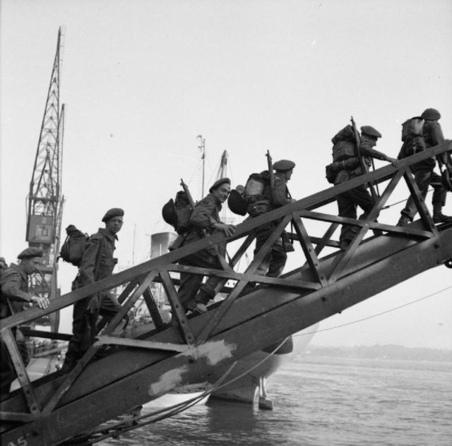 Operation Overlord. British troops walking up the gangway of landing craft SS EMPIRE LANCE, on the way to France from Southampton.