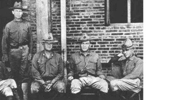 Butler (far right) with three other legendary Marines. From left to right: Sergeant Major John H. Quick, Major General Wendell Cushing Neville, Lieutenant General John Archer Lejeune.