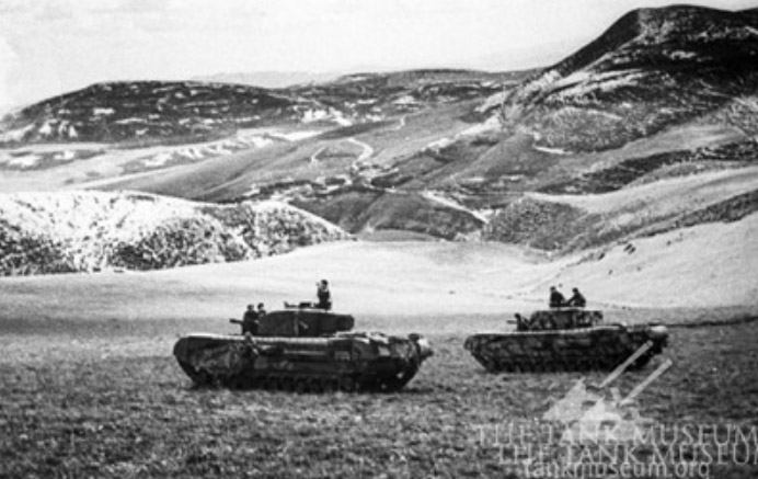 Churchill tanks keep watch during the Tunisian campaign