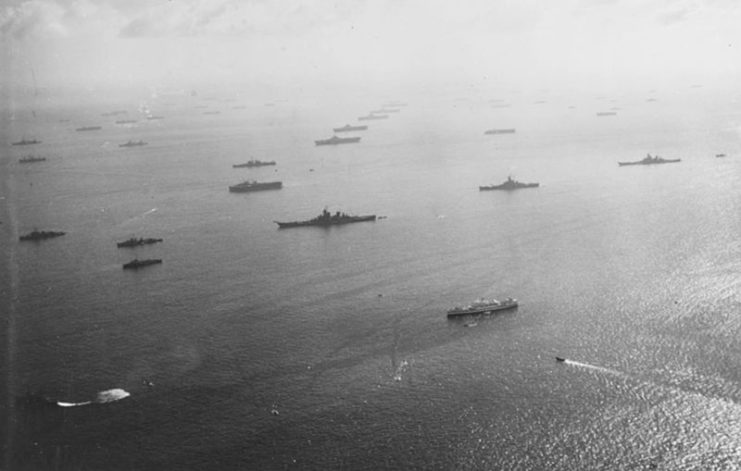 U.S. Navy 3rd Fleet warships and auxiliaries anchored at Ulithi Atoll, Caroline Islands, shortly after the Battle of Leyte Gulf, on 6 November 1944. The battleships USS New Jersey (BB-62) and USS Iowa (BB-61) are in the center and at right. Five Essex-class carriers are moored in line in the upper center.