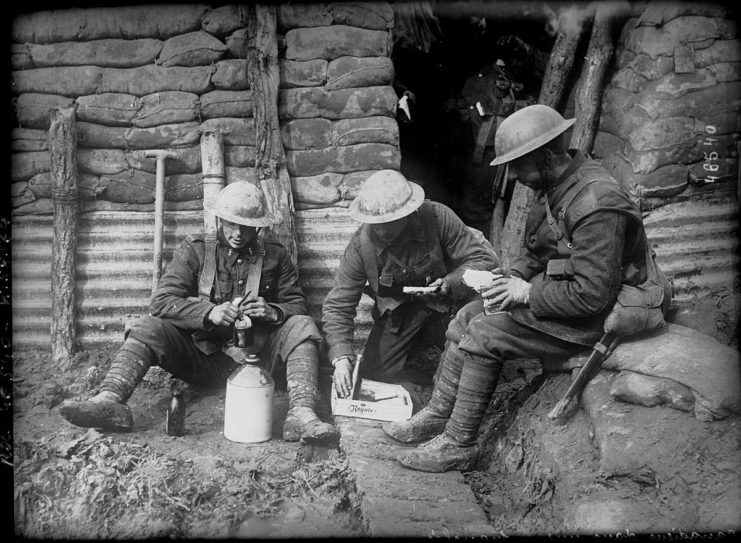 Canadian soldiers resting in a trench