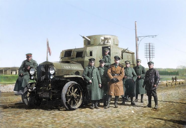 German Officers with an armored car. Photo colourised by Royston Leonard / mediadrumworld.com