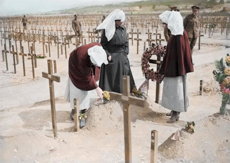 Nuns, part of an order of nurses tending to graves. Photo colourised by Royston Leonard / mediadrumworld.com