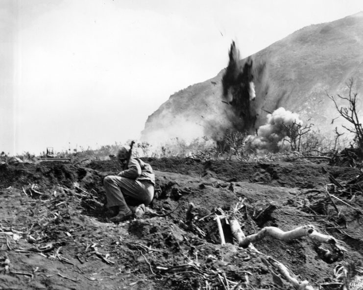 Iwo Jima, February 24, 1945. Scratch One Japanese Position: A Japanese position at the base of Mount Suribachi is eliminated by a high explosive charge set off by the invading Marines. By USMC Archives CC BY 2.0