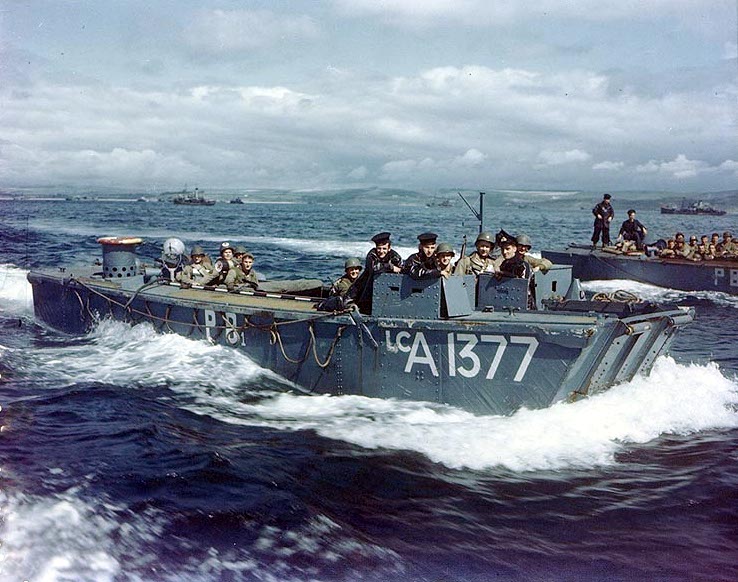 British Navy Landing Craft LCA-1377 carries American troops to a ship, in a British port during preparations for the Normandy invasion, circa May-June 1944.