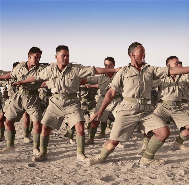 Maoris of ‘C’ Company, 28th Maori Battalion of the 2nd New Zealand Division perform the ‘Haka’ for the visit of King George II of Greece, his wife the Queen, his cousin Prince Peter and Major General Freyberg. The location was at an army training camp at Helwan in Egypt. Paul Reynolds / mediadrumworld.com