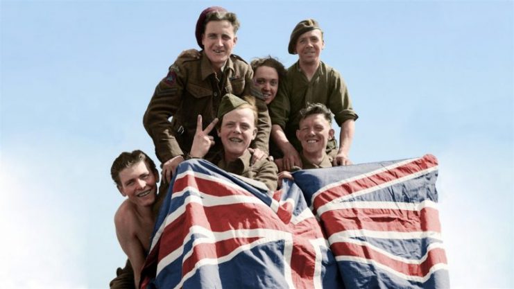British Prisoners of War celebrate their liberation from Stalag 11B at Fallingbostel, 16 April 1945. From left to right: Private Smyth of Downham, captured at Cherbourg in 1944; Private Ryan of Bradford, captured at Hertogenbosch, 1944; Corporal Beardmore of Cheadle, captured at Arnhem, 1944; Private Still of Manchester, captured at Arnhem, 1944 and Private Greare of Glasgow, captured at St. Valery, 1940. Paul Reynolds / mediadrumworld.com