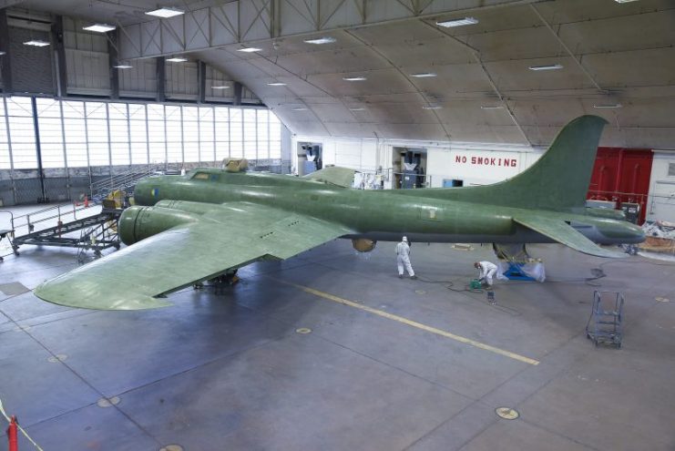 National Museum of the U.S. Air Force restoration crews continue the painting process on the Boeing B-17F Memphis Belle. At this stage, the undercoat layers are mostly finished. (U.S. Air Force photo by Ken LaRock)