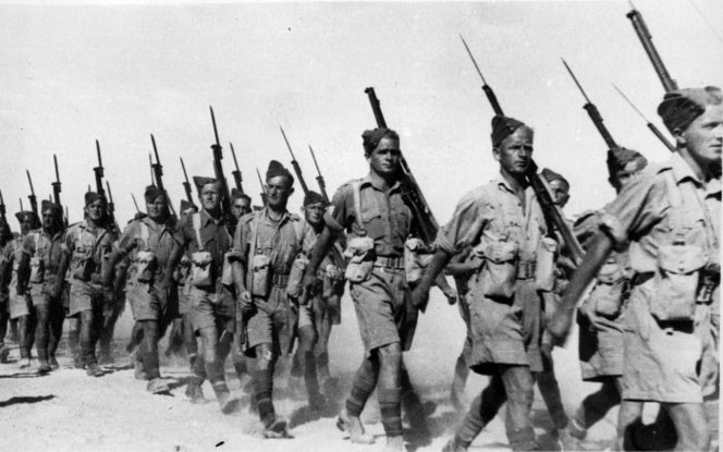 Soldiers of the 2nd NZEF, 20th Battalion, C Company marching in Baggush, Egypt, September 1941.