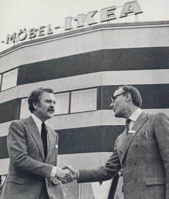 IKEA founder Ingvar Kamprad (right) shakes hands with Hans Ax, IKEA’s first store manager