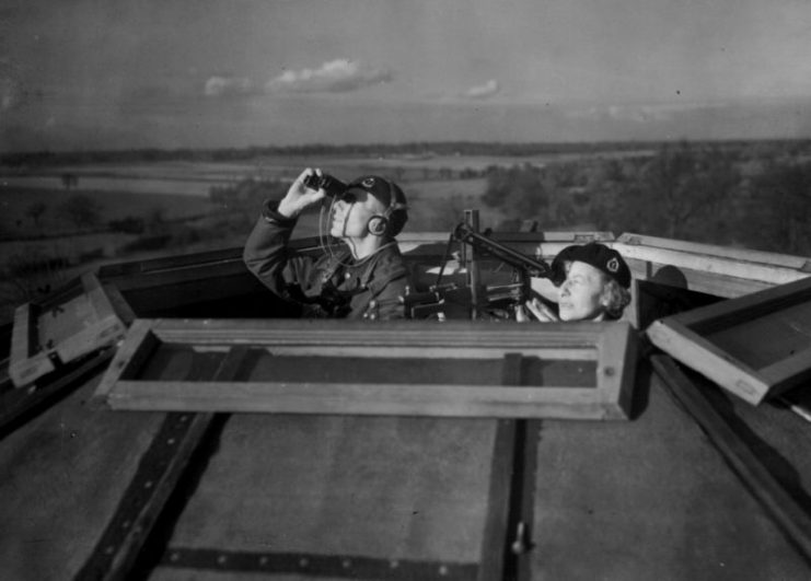 Photograph depicting Royal Observer Corps aircraft spotters in the period immediately after the Battle of Britain during 1941.